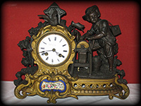 Pendule XIXème au rémouleur bronze et porcelaine